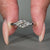 Round cut diamond ring featuring a classic prong setting.
