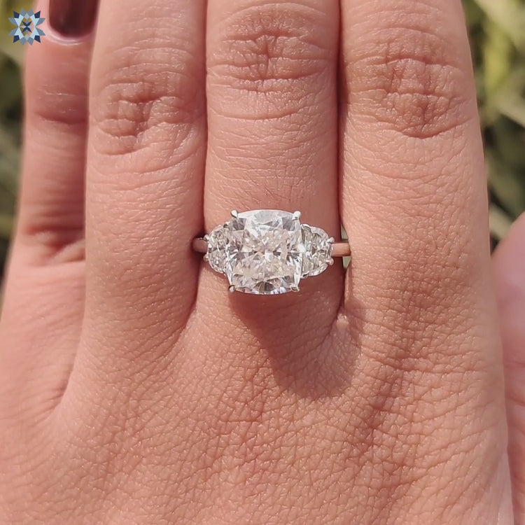 Cushion cut engagement ring with half moon shaped sides.
