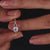 Round cut engagement ring featuring muse setting
