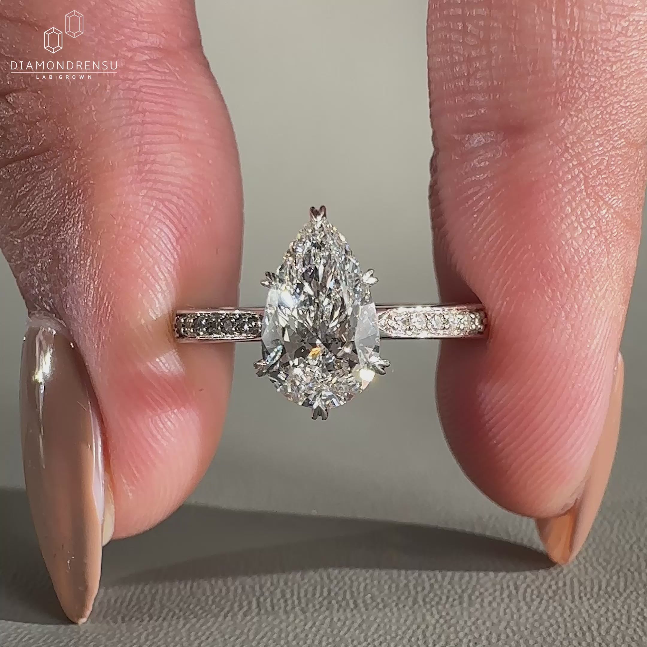 Tapered pave engagement ring set in 6 prong setting.
