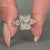 This radiant cut ring includes oval diamond ring details.
