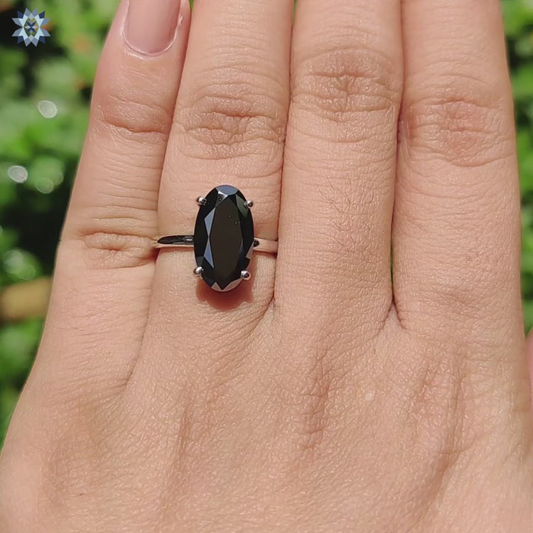 Moissanite engagement ring in solitaire hidden halo setting.
