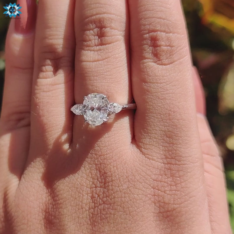 UK-made white gold ring with three moissanite stones.
