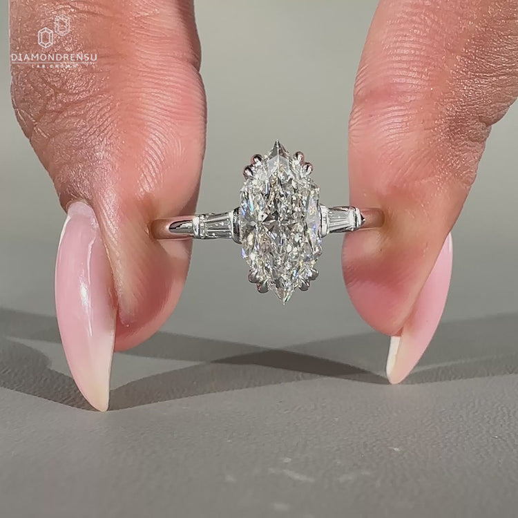 Dutch Marquise engagement ring with tapered baguettes.
