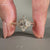 Marquise cut diamond cluster ring with round side diamonds.
