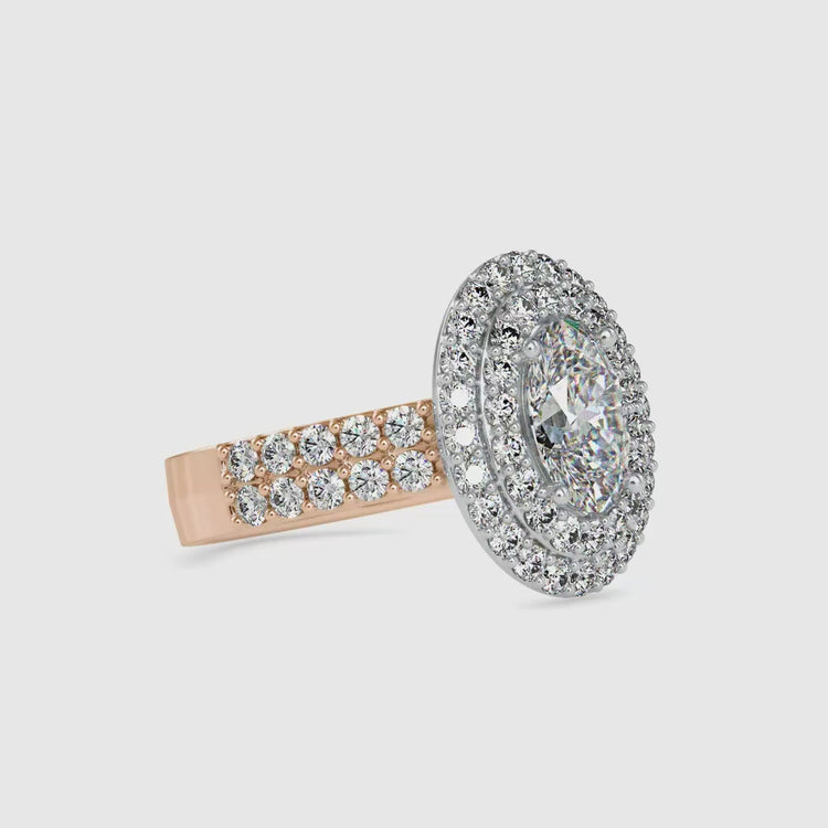 Rose gold engagement ring with oval diamond and double row band.
