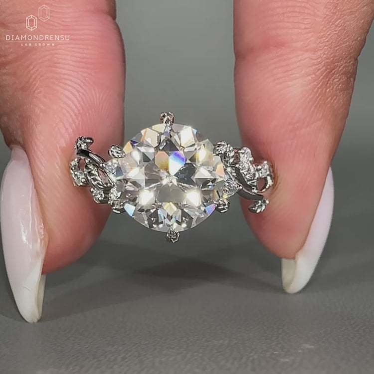 Nature inspired diamond ring featuring lab grown diamonds in a vintage setting.
