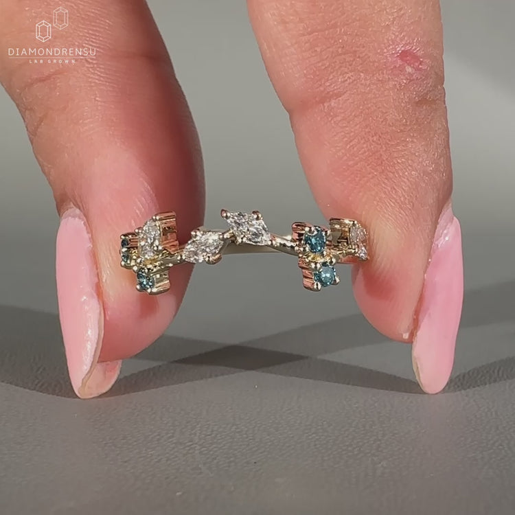 Marquise and round diamond band in prong setting.

