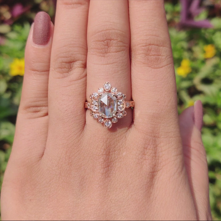Round cut side stones on vintage engagement ring.
