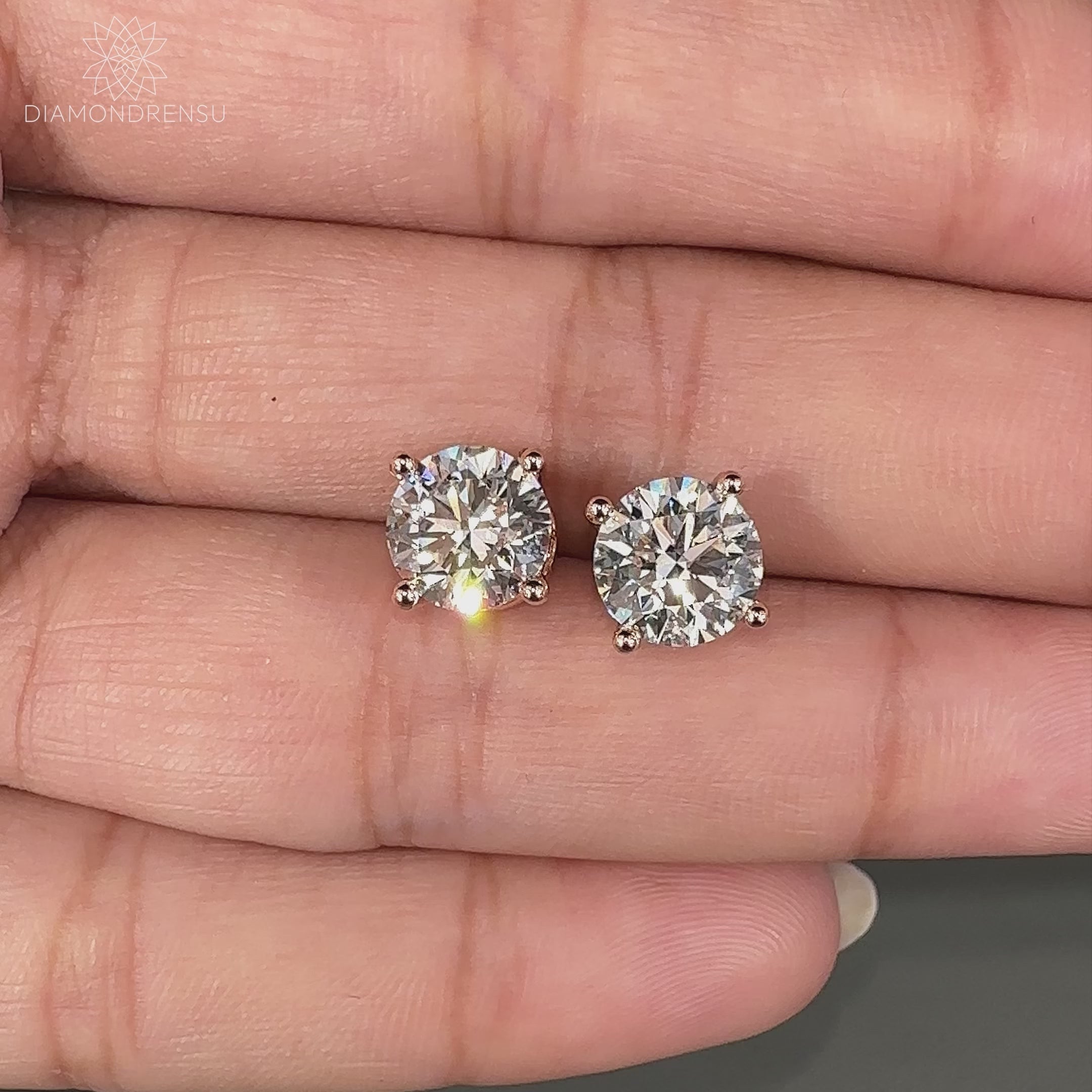 Push back diamond earrings with round cut.