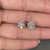Push back diamond earrings with round cut.