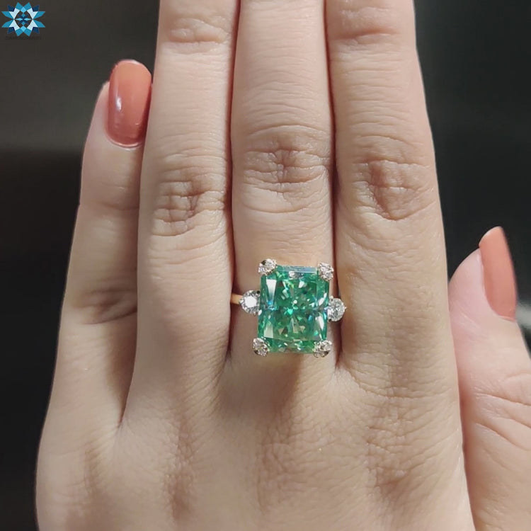 Cyan moissanite ring crafted in yellow gold.

