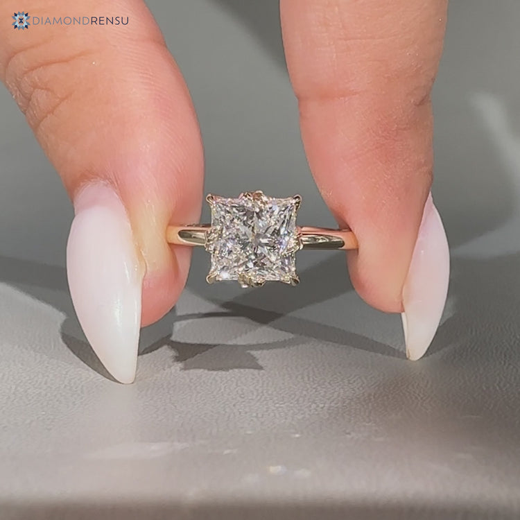 Nature inspired princess cut solitaire engagement ring.