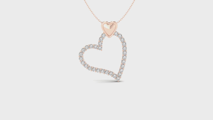 White gold pendant with heart shaped setting and lab grown diamond.
