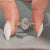 Art deco oval diamond ring with hidden flower design.