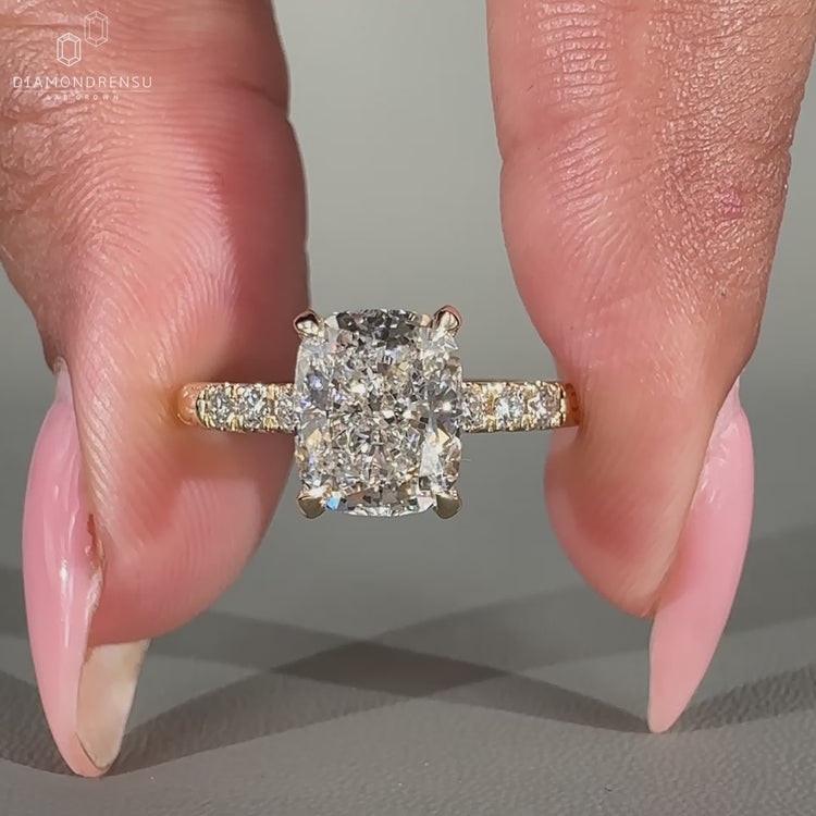 Cushion diamond ring made with prong setting.