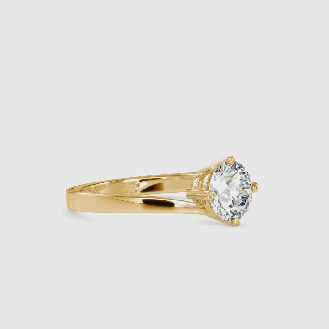 Elegant bypass ring setting featuring a solitaire cut diamond.