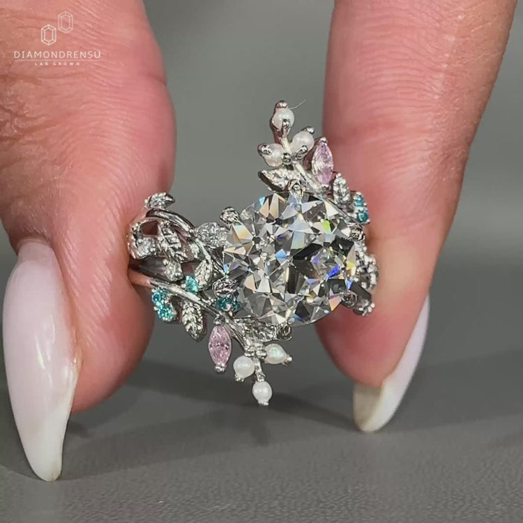 Round old European cut ring with leaf style pave setting.
