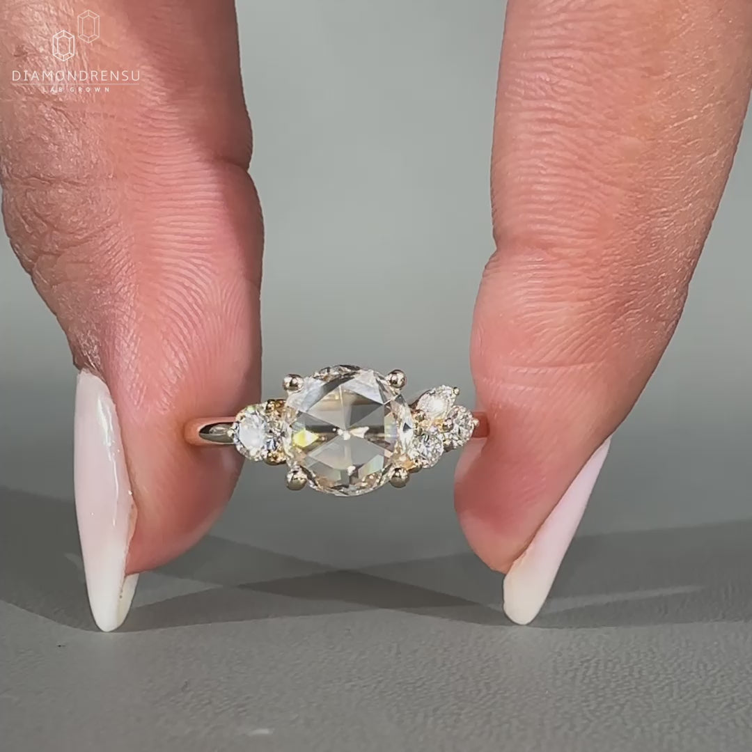 Round engagement ring includes a round rose cut ring design.
