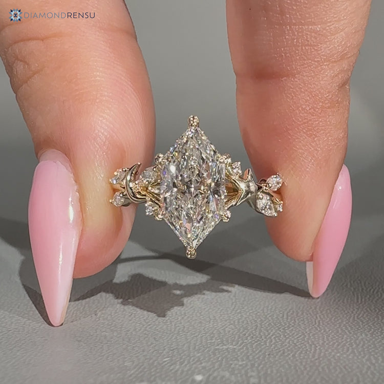 Nature inspired Dutch marquise ring with star and moon design.