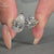 Elegant pave setting ring with two stones in claw prong design.
