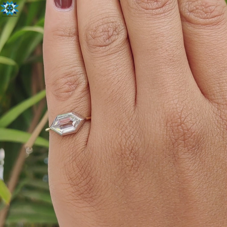 Custom engagement ring with bezel mounted hexagon moissanite.
