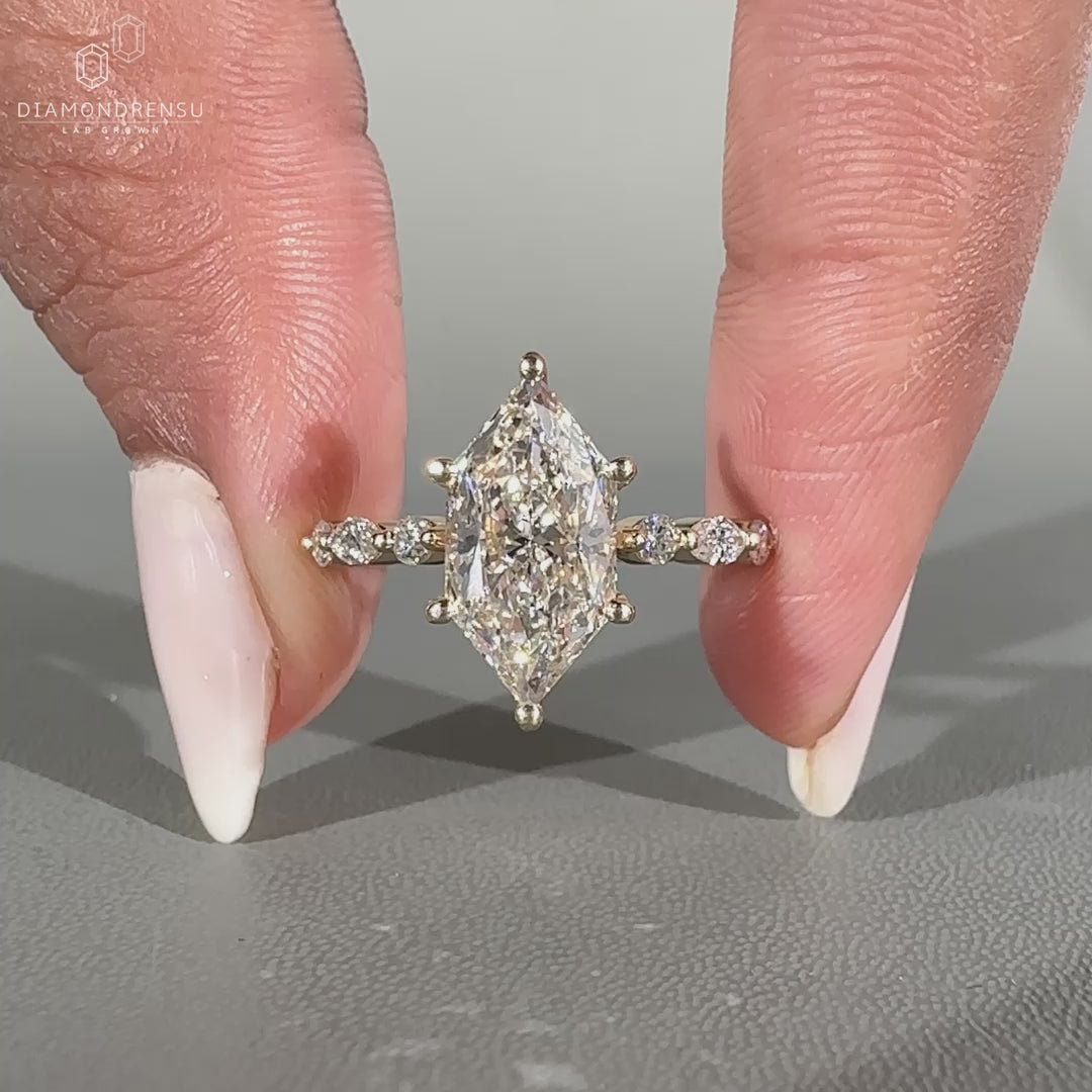 Shared prong pave band ring featuring seven diamonds.
