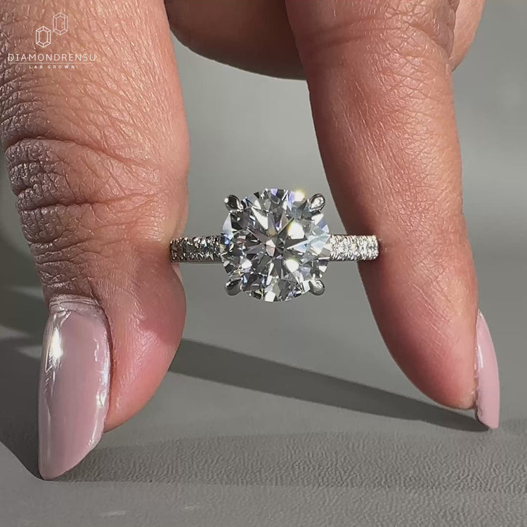 White gold ring featuring a round cut lab grown diamond.
