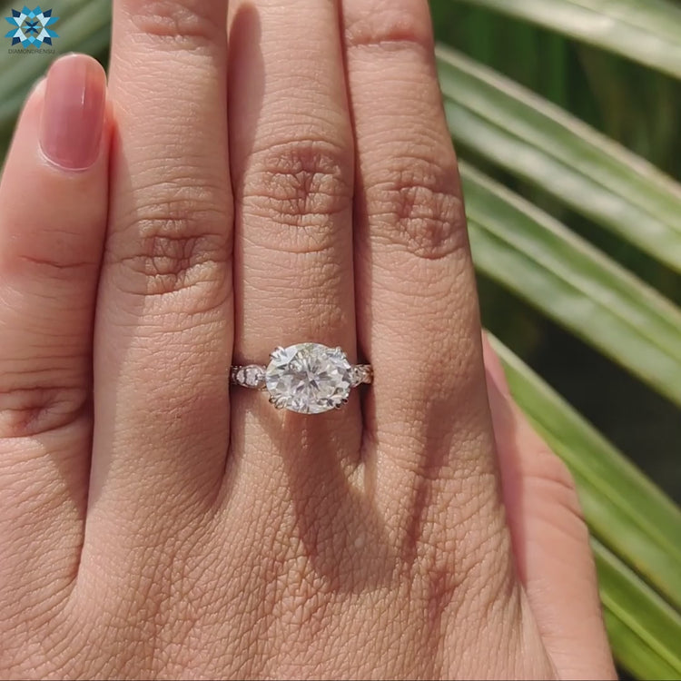 Oval cut moissanite set in a white gold prong setting for a timeless look.
