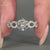 Twisted pave engagement ring crafted in white gold with round cut diamonds.

