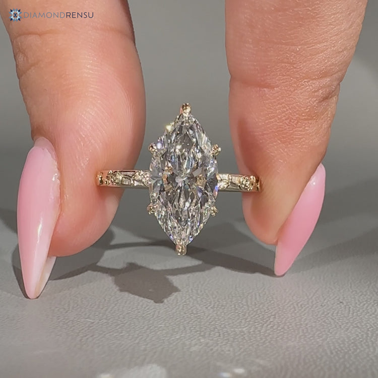 Marquise cut ring with nature inspired floral details.