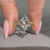 Nature inspired ring with hidden blue round gemstone.