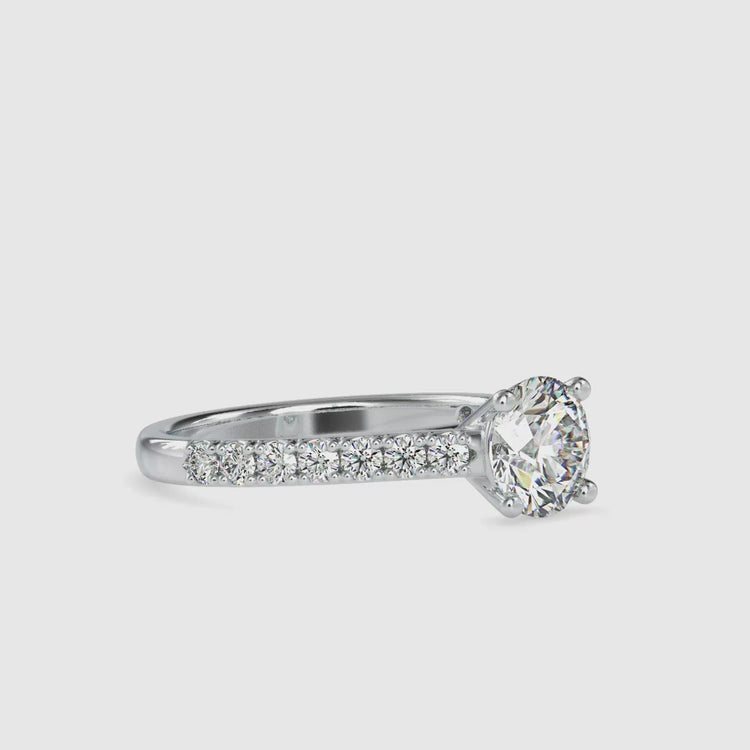 Lab grown diamond engagement ring with pave band and round cut.