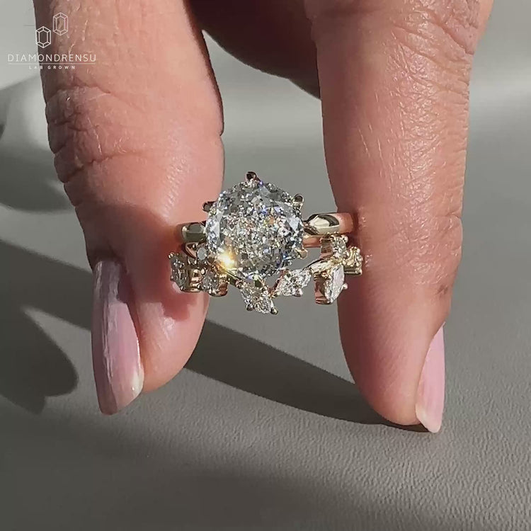 Portuguese cut diamond ring paired with a curved wedding band.
