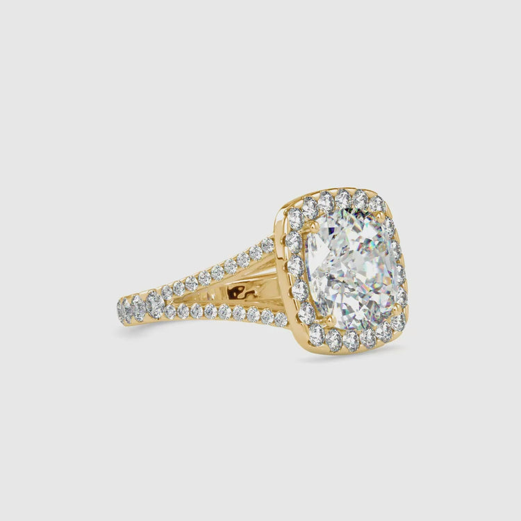 Handmade ring featuring cushion and round diamonds.
