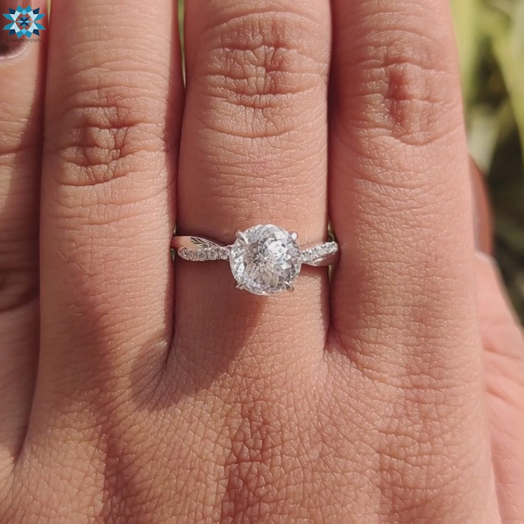 Round cut Portuguese engagement ring with secure 4 claw prong setting.
