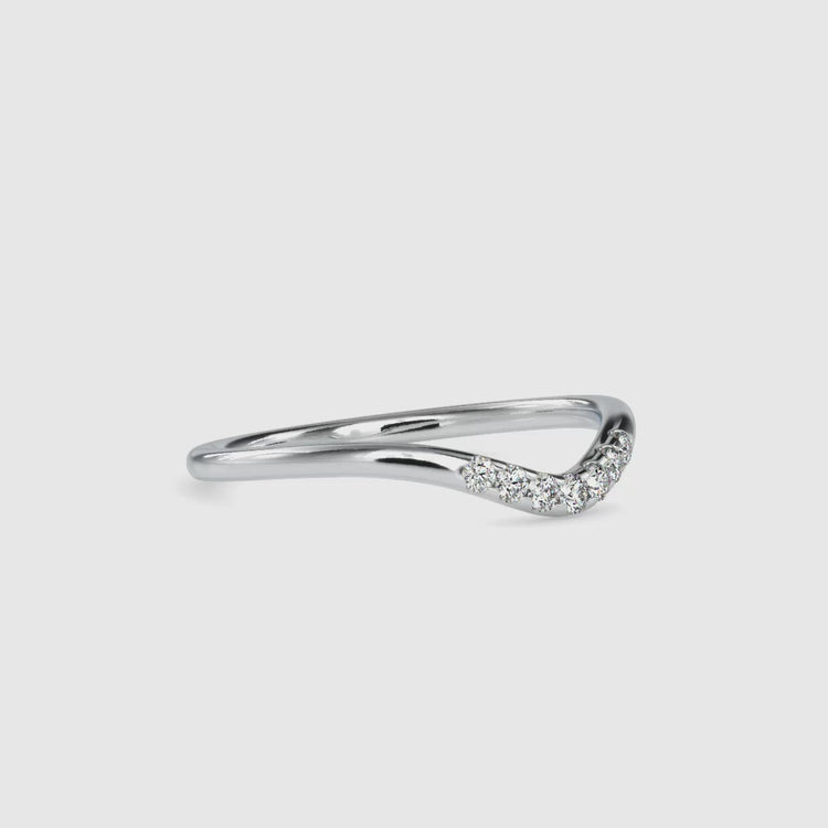 Curved wedding band made with lab grown diamonds.