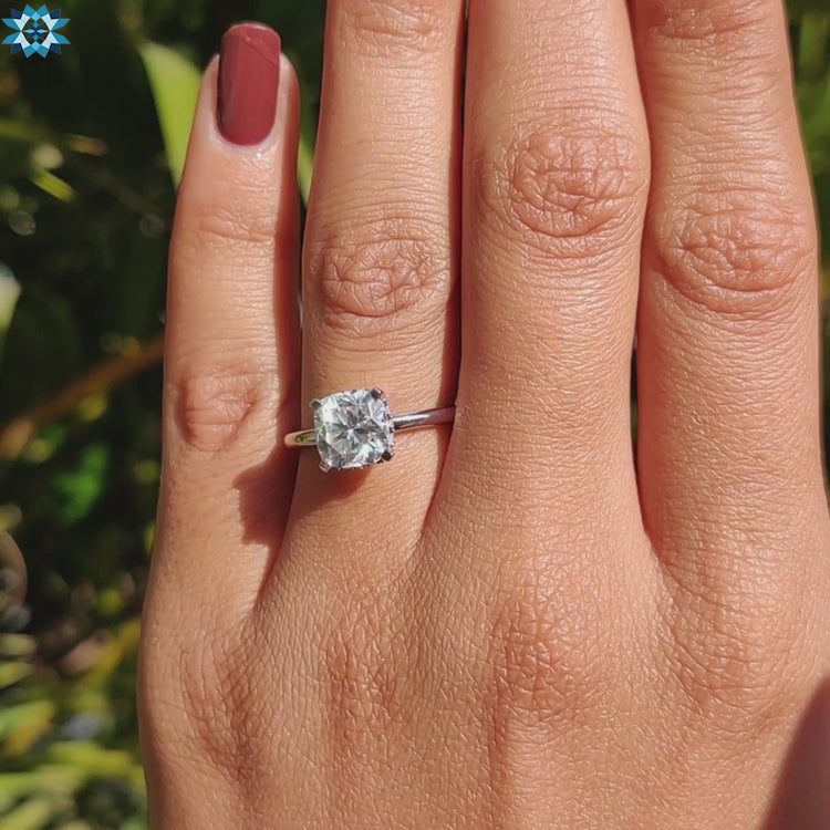 Custom moissanite engagement ring with halo detail.
