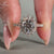 Halo diamond ring crafted in elegant rose gold.
