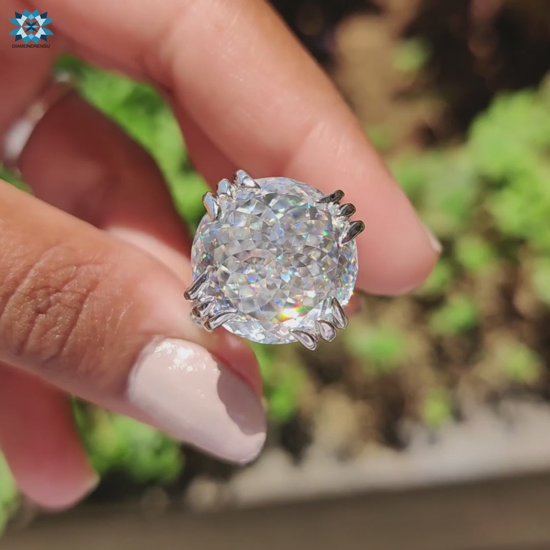 Vintage engagement ring featuring moissanite and fishtail prong setting.
