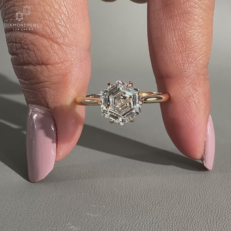 Hexagon diamond ring featuring a 6 claw prong setting.
