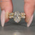 Oval centre diamond with marquise and round side stones.