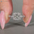 Handmade princess cut ring with pear side stone.