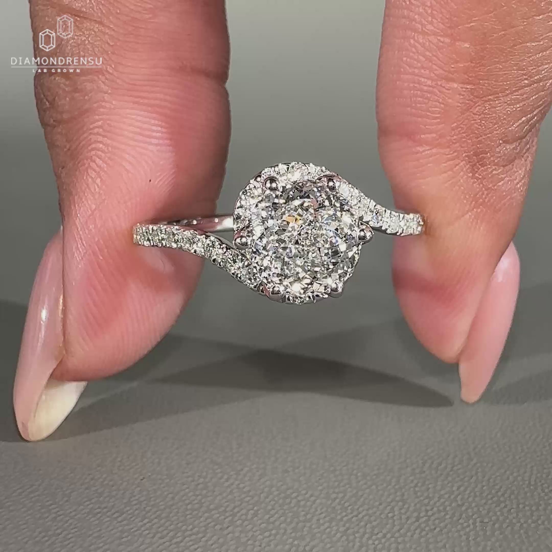 This ring features a round diamond at the center.
