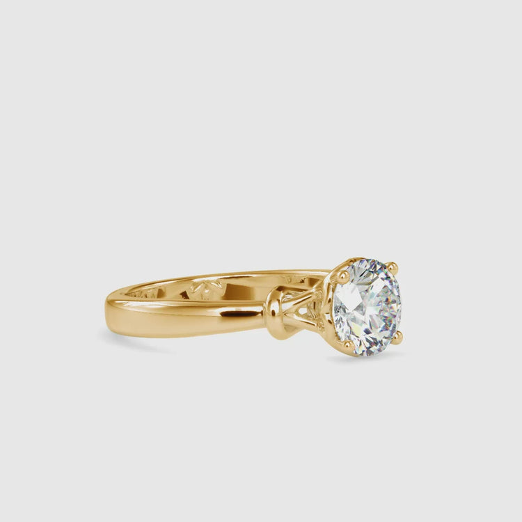 Round diamond ring in yellow gold with solitaire look, UK crafted.
