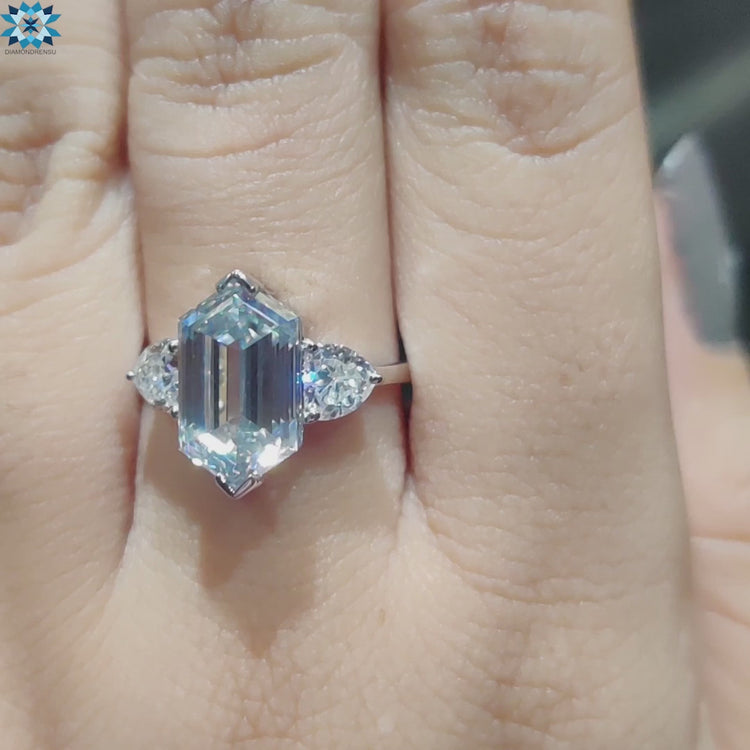 Prong set hexagon moissanite ring in white gold.
