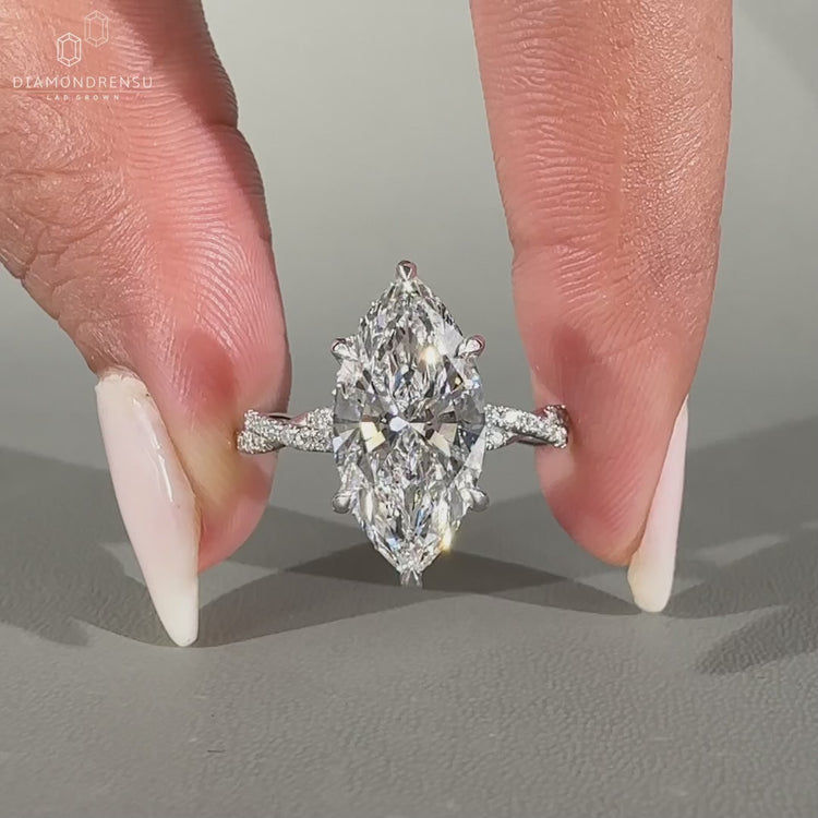 Marquise cut diamond ring featuring a hidden halo.
