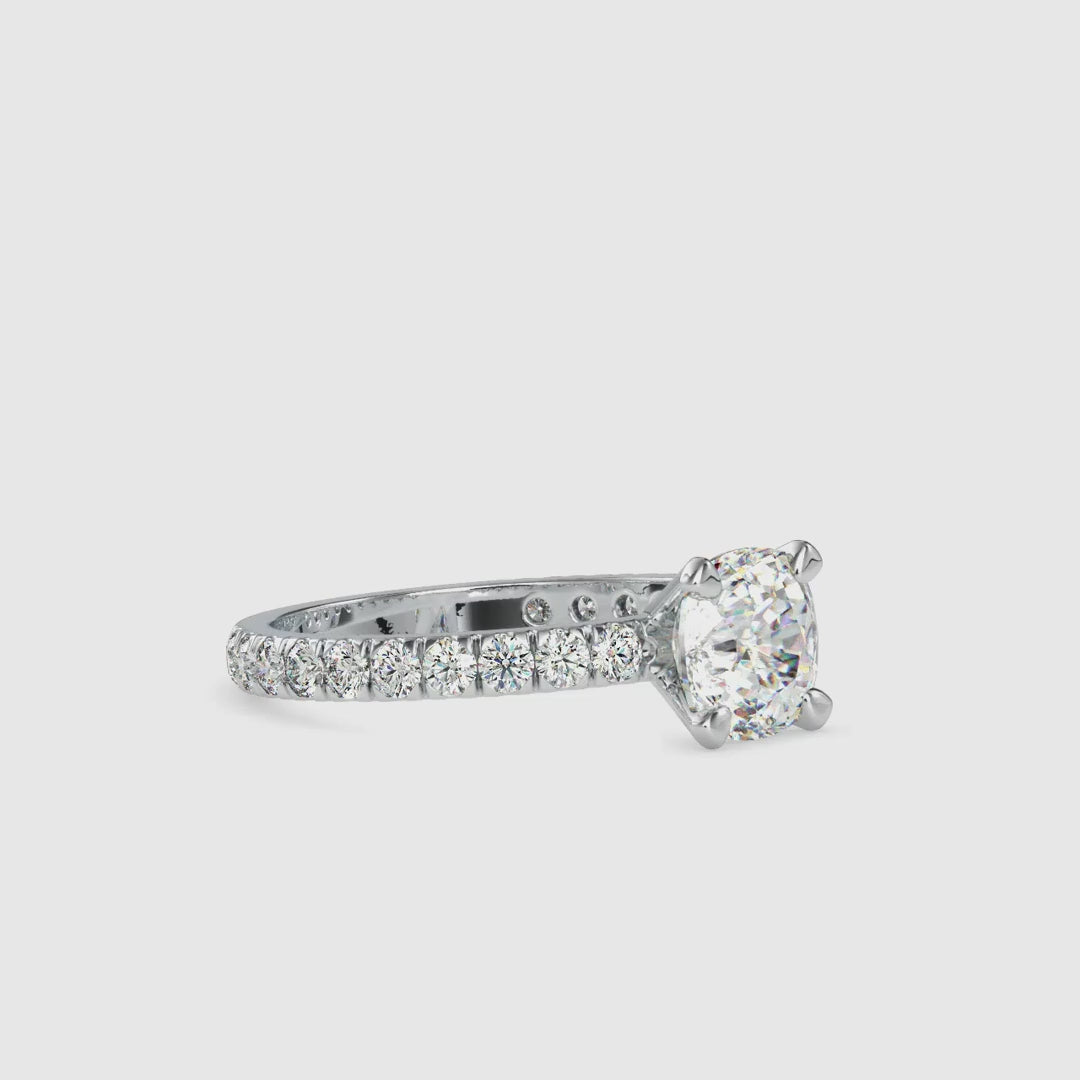 Cushion cut diamond ring with claw prong ring in yellow gold for a classic engagement look.
