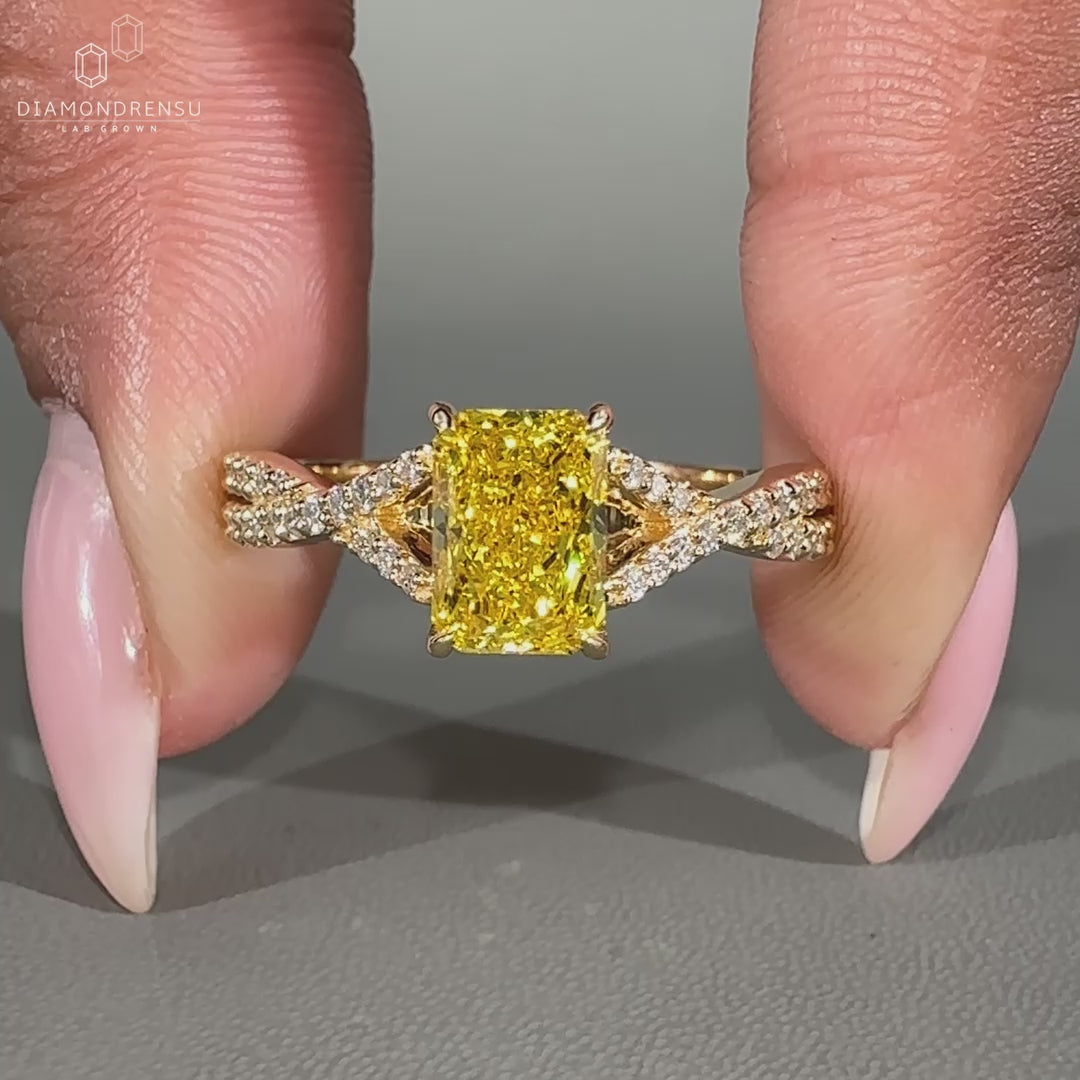 Radiant cut engagement ring designed in yellow gold ring style.
