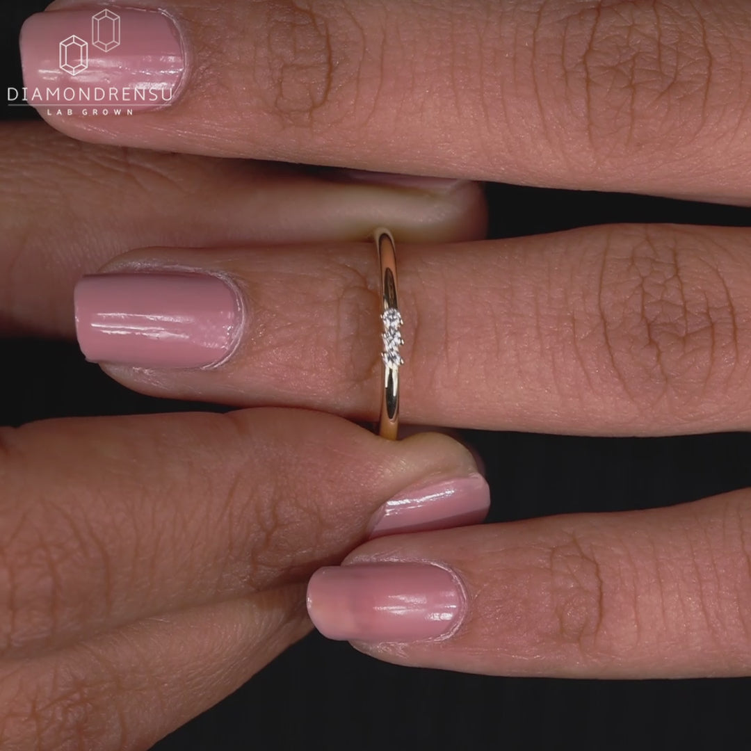 Three stone yellow gold wedding band.
